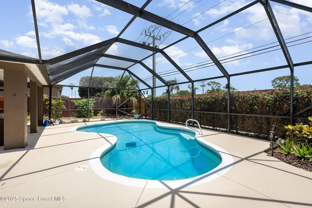 a indoor swimming pool with view of outdoor seating