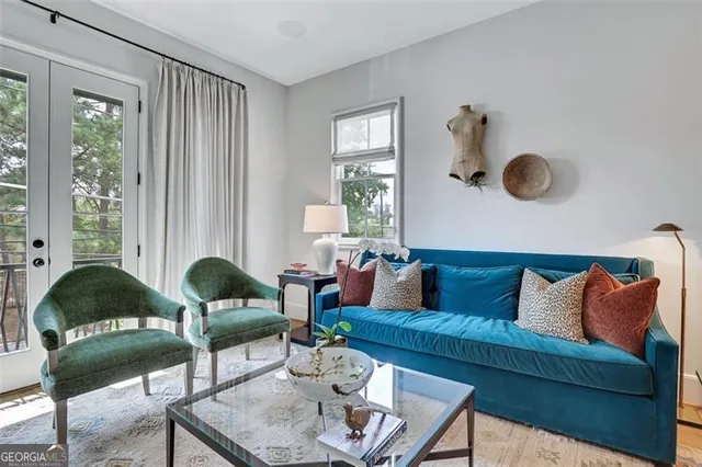 a living room with furniture and a large window