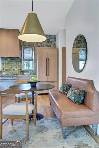a kitchen with a sink appliances and cabinets