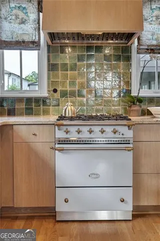 a kitchen with a table and a stove