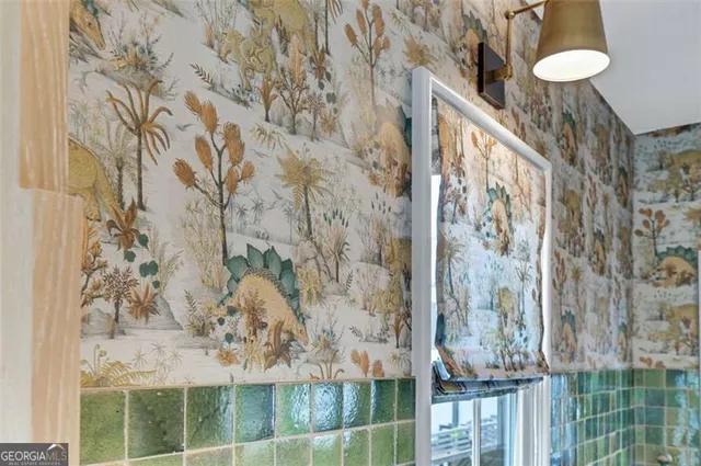 a stove top oven sitting inside of a kitchen