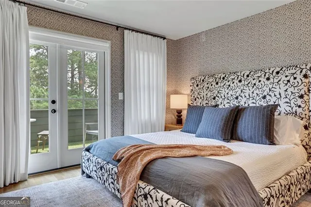 a bedroom with a bed and a mirror