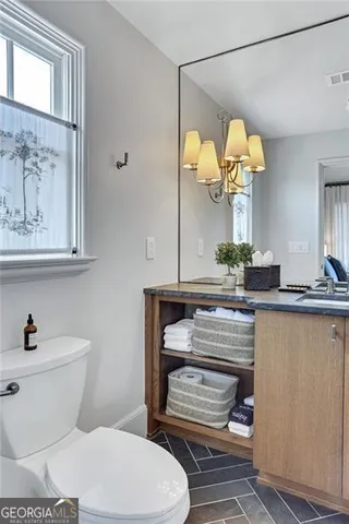 a view of a balcony with table and chairs
