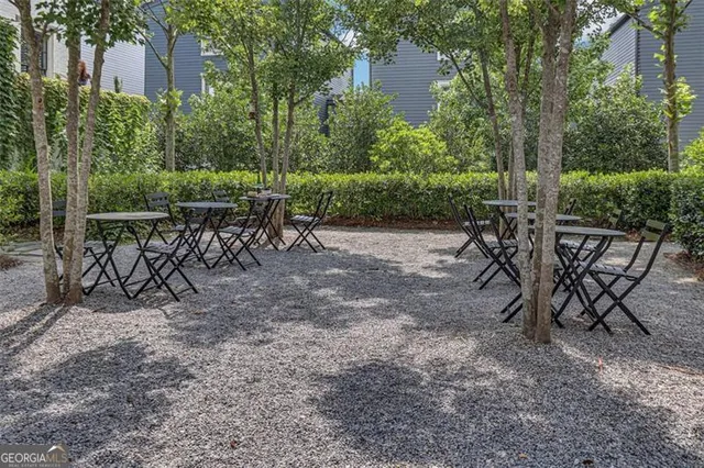 a view of a house with potted plants