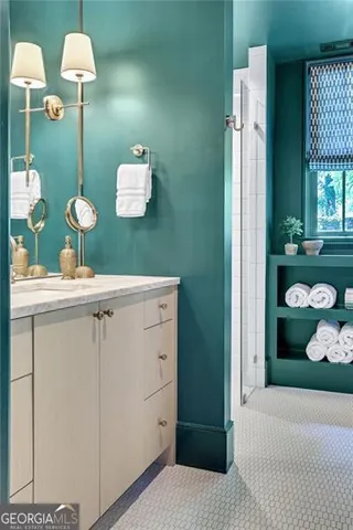 a bathroom with a sink a vanity and a mirror