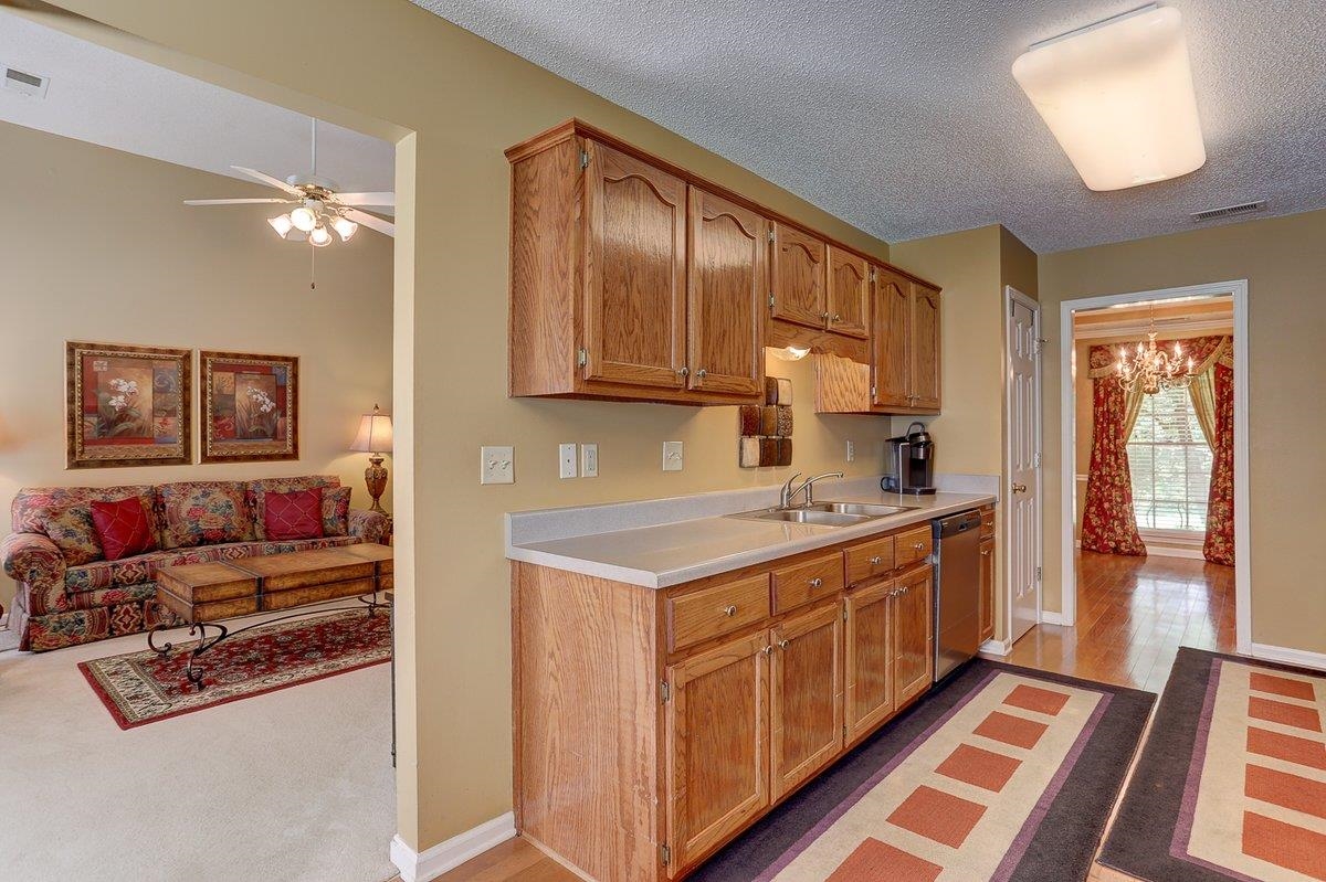 3365 Harrell Road Arlington, TN 38002 - Photo 11 of 36 a kitchen with stainless steel appliances granite countertop a stove and a refrigerator