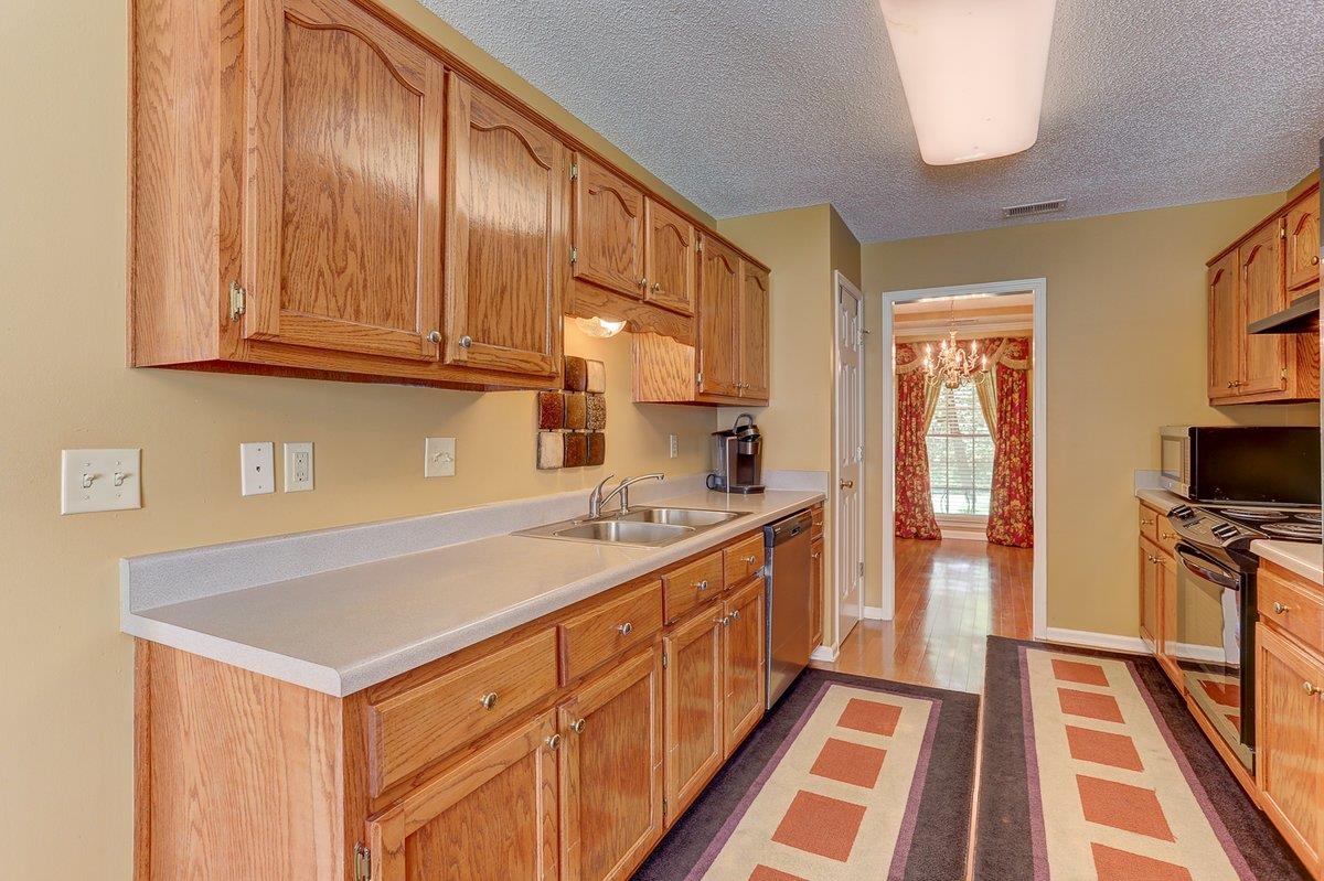 3365 Harrell Road Arlington, TN 38002 - Photo 13 of 36 a kitchen with a stove and a sink