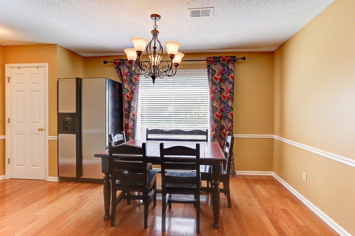 3365 Harrell Road Arlington, TN 38002 - Photo 15 of 36 a view of a dining room with furniture and wooden floor