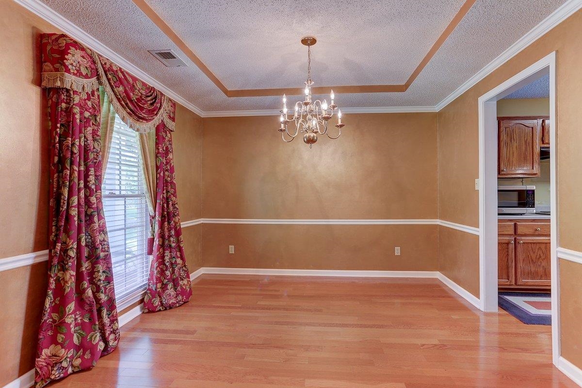 3365 Harrell Road Arlington, TN 38002 - Photo 18 of 36 a view of livingroom with hardwood floor and kitchen