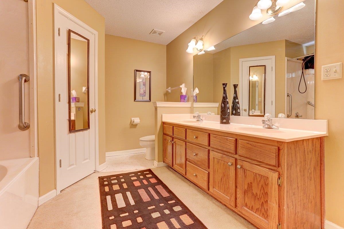 3365 Harrell Road Arlington, TN 38002 - Photo 23 of 36 a spacious bathroom with a shower a sink and a mirror