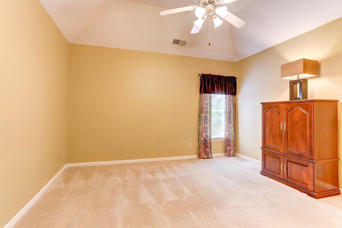 3365 Harrell Road Arlington, TN 38002 - Photo 26 of 36 a view of an empty room with wooden floor and a window