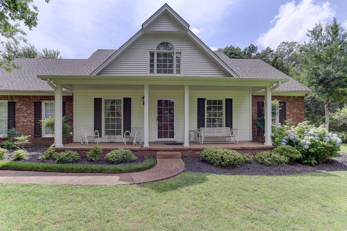 3365 Harrell Road Arlington, TN 38002 - Photo 33 of 36 a front view of a house with garden