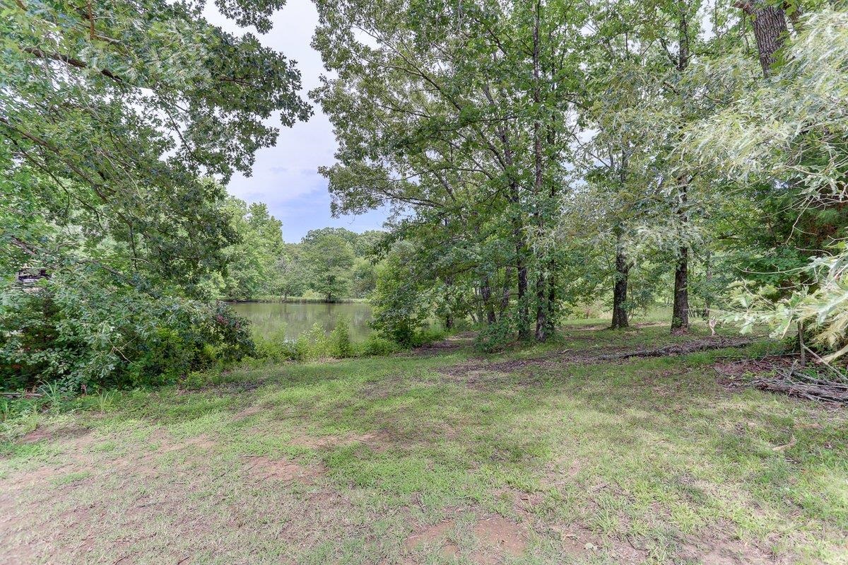 3365 Harrell Road Arlington, TN 38002 - Photo 34 of 36 a view of a field with trees in the background