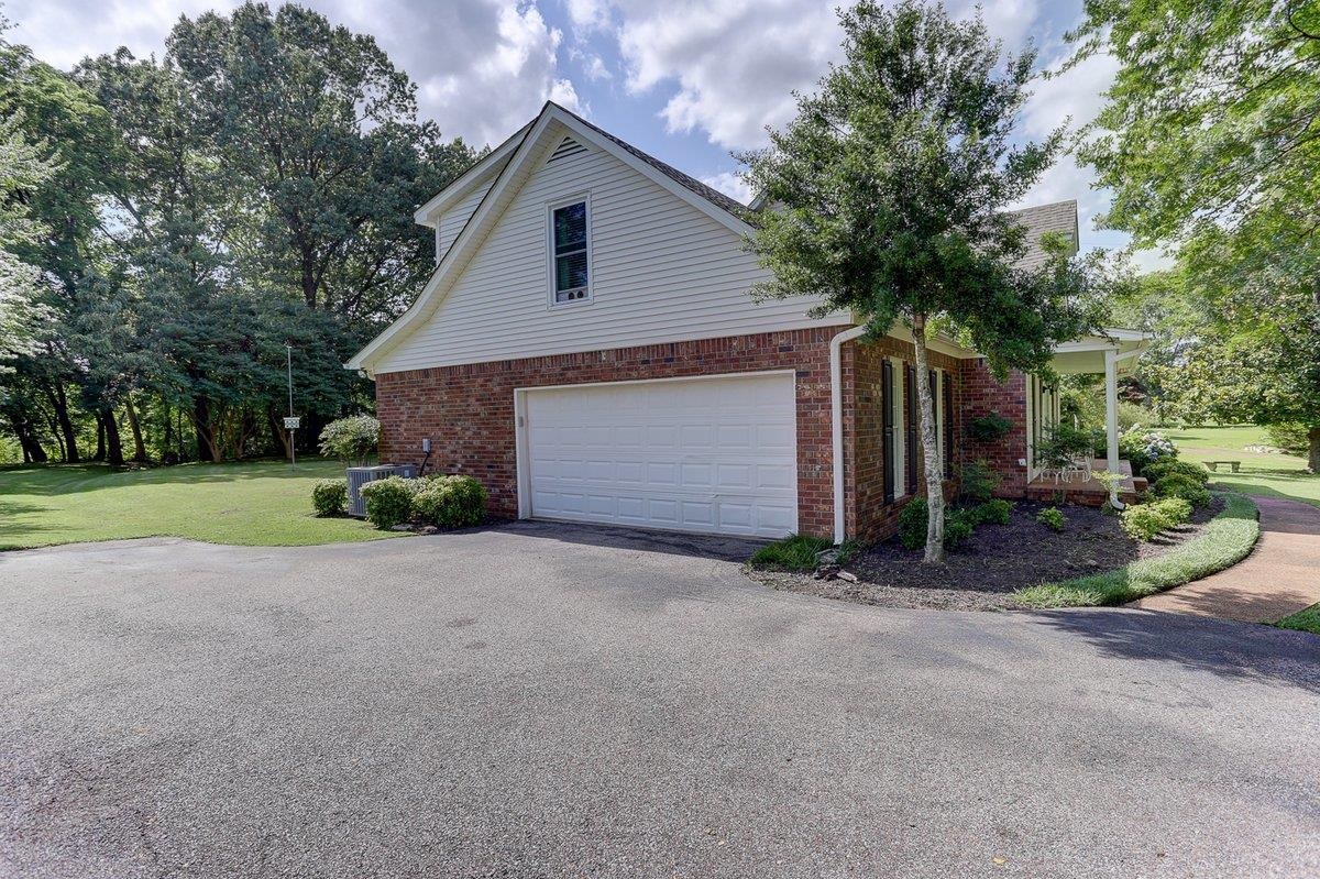 3365 Harrell Road Arlington, TN 38002 - Photo 36 of 36 a view of a house with backyard and garage