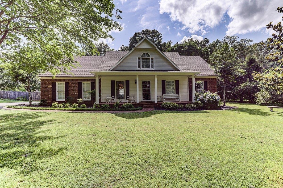 3365 Harrell Road Arlington, TN 38002 - Photo 6 of 36 a front view of house with yard and trees in the background
