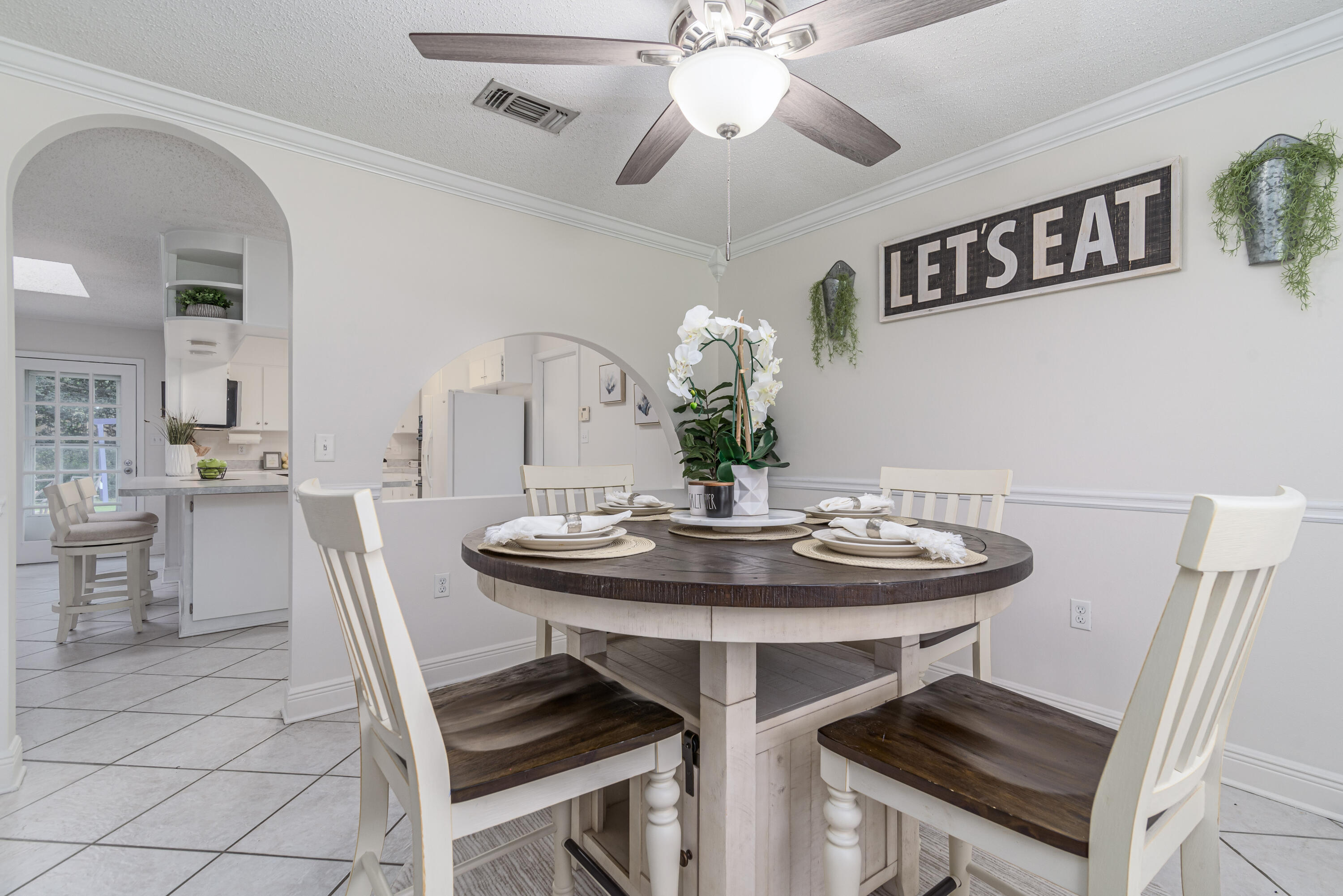 207 Country Club Road Shalimar, FL 32579 - Photo 12 of 60 a view of a dining room with furniture and chandelier