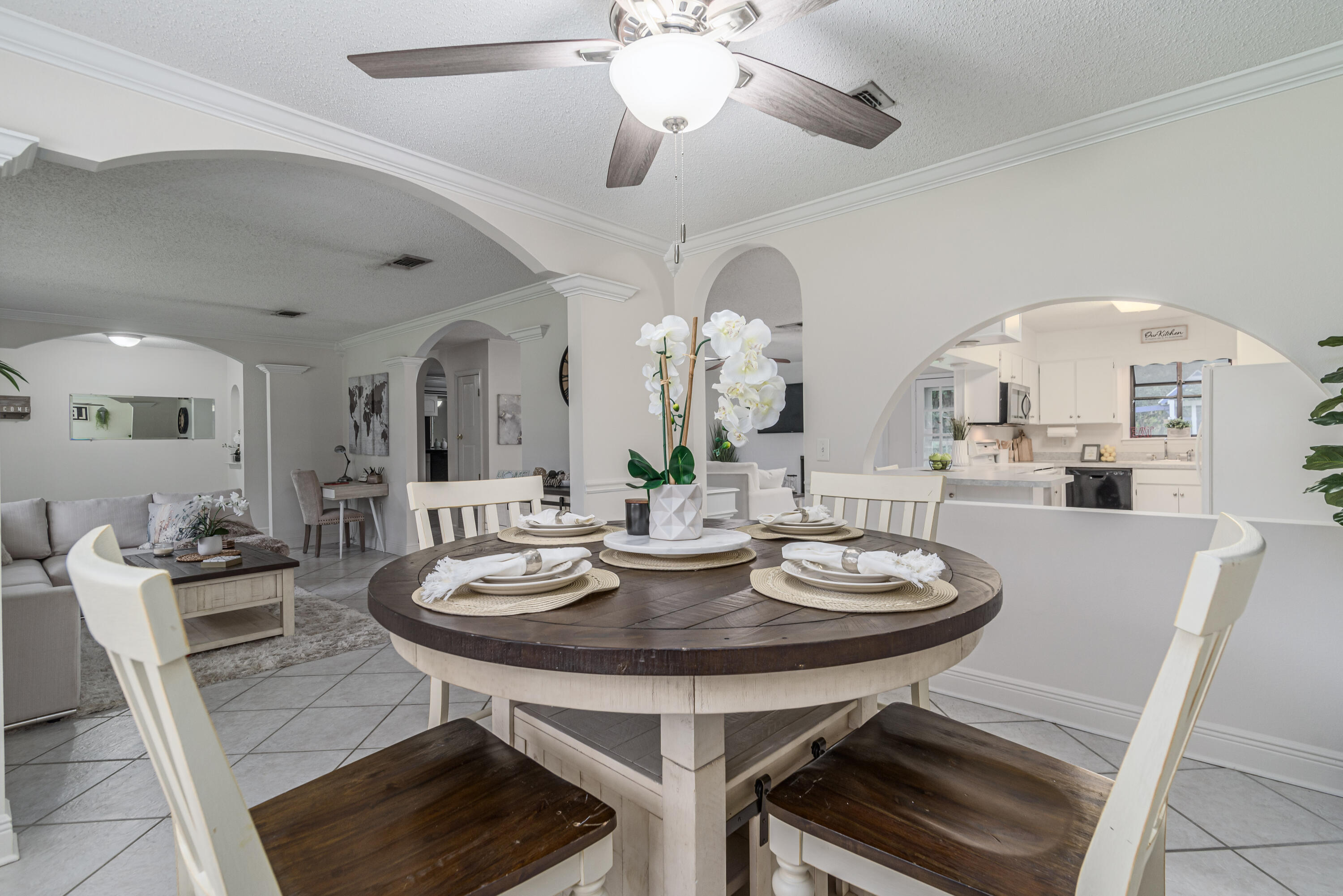 207 Country Club Road Shalimar, FL 32579 - Photo 13 of 60 a view of a dining room with furniture and a chandelier fan