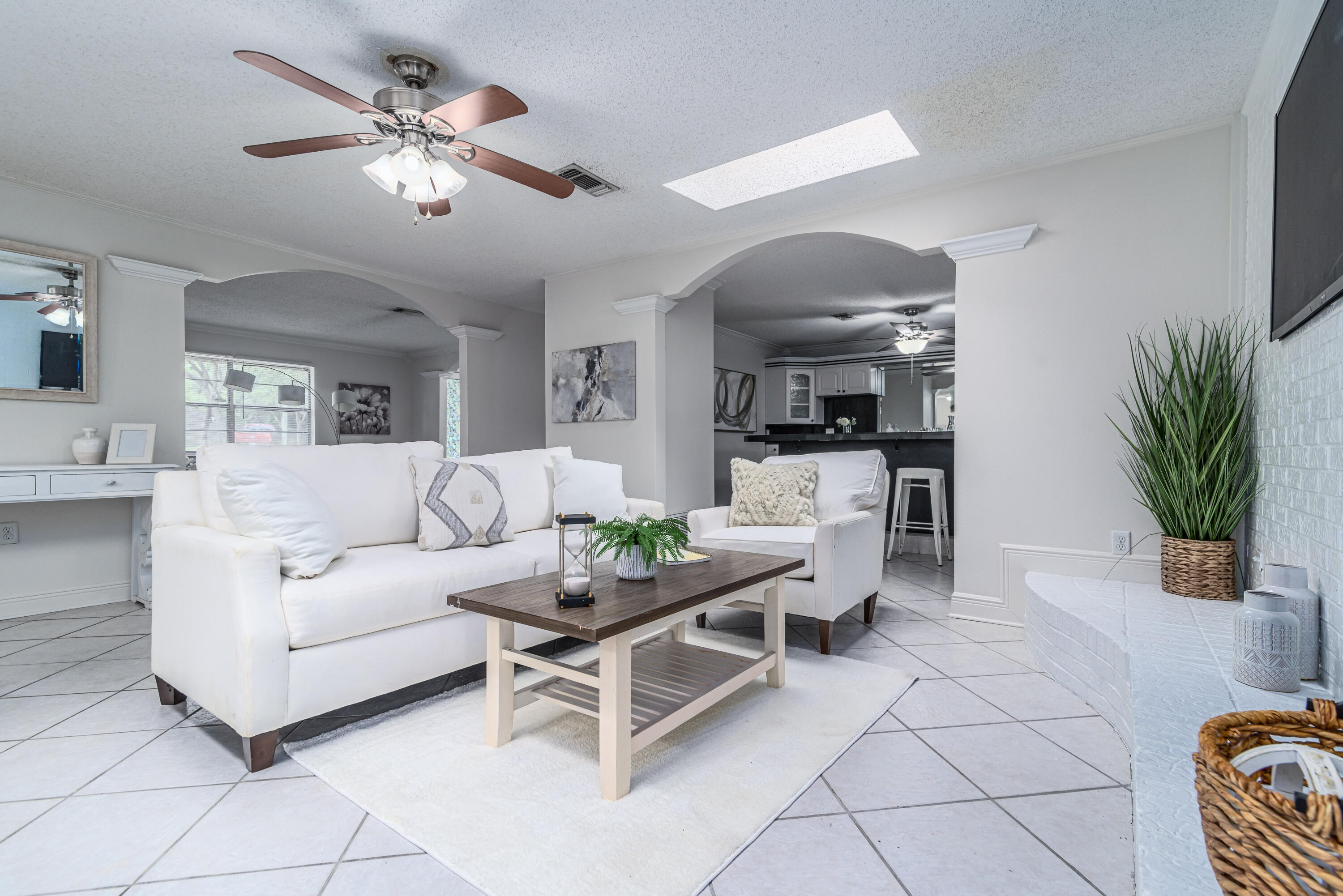 207 Country Club Road Shalimar, FL 32579 - Photo 24 of 60 a living room with furniture potted plant and a chandelier