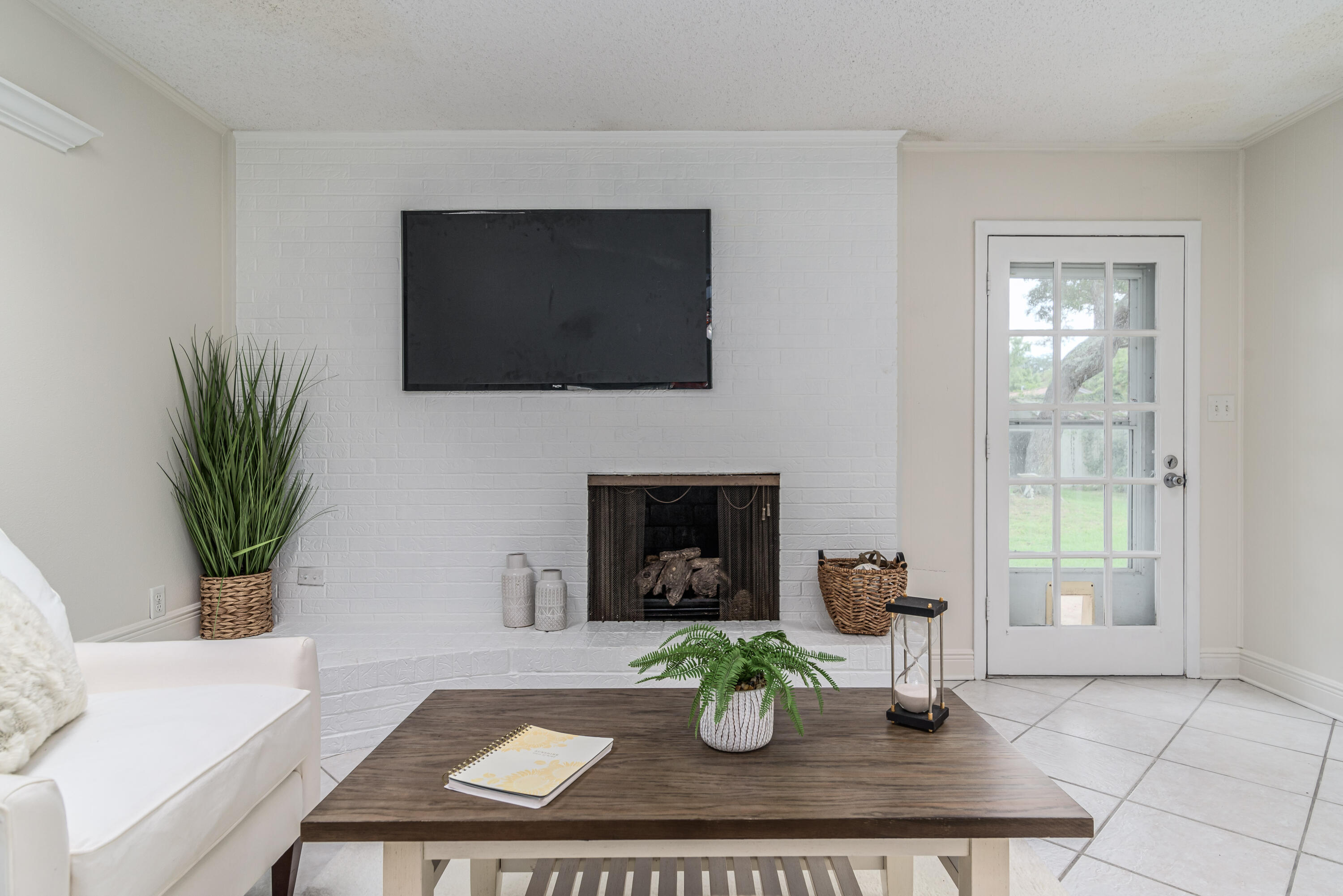 207 Country Club Road Shalimar, FL 32579 - Photo 27 of 60 a view of living room with furniture and a fireplace