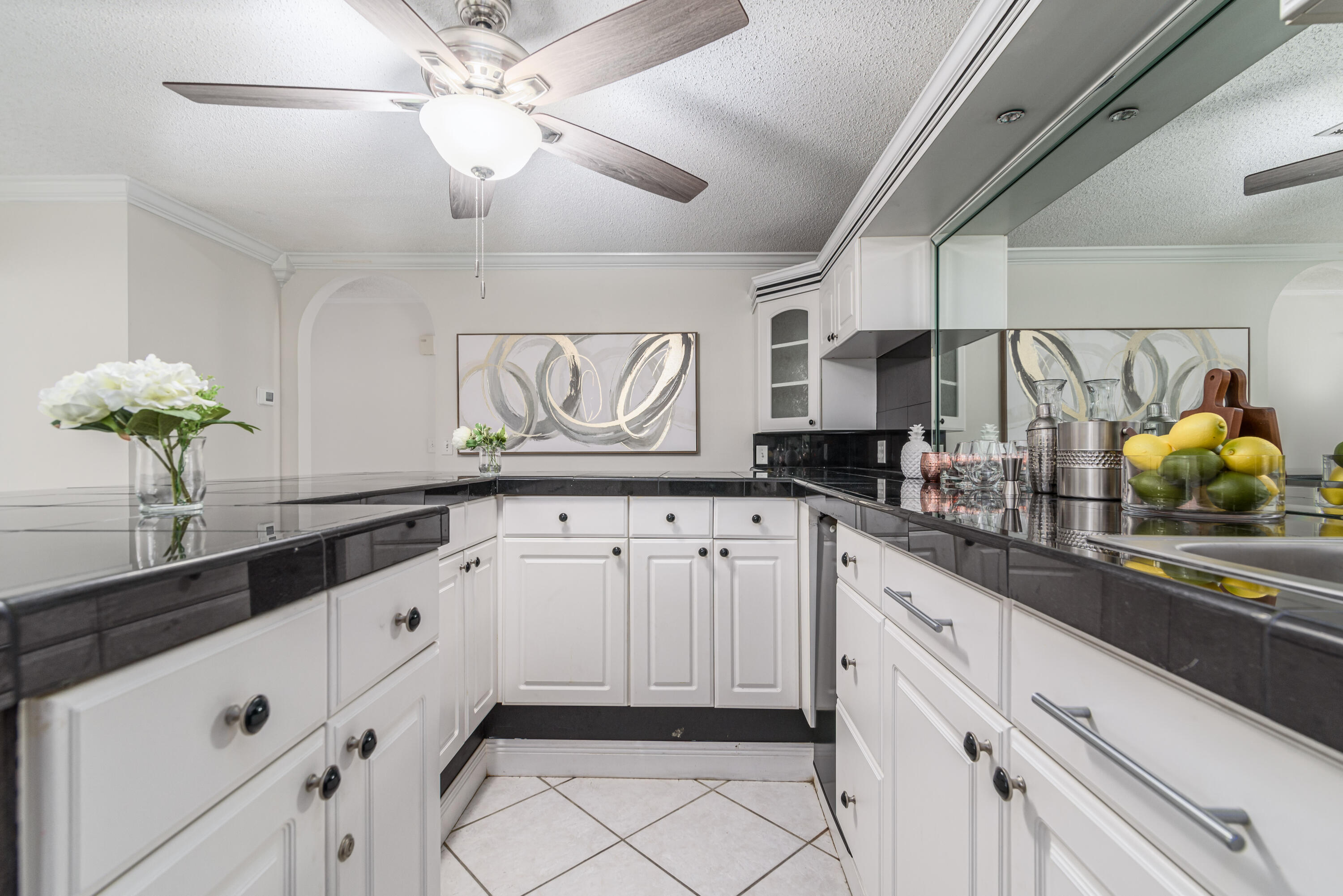 207 Country Club Road Shalimar, FL 32579 - Photo 33 of 60 a kitchen with granite countertop white cabinets white countertops and a sink