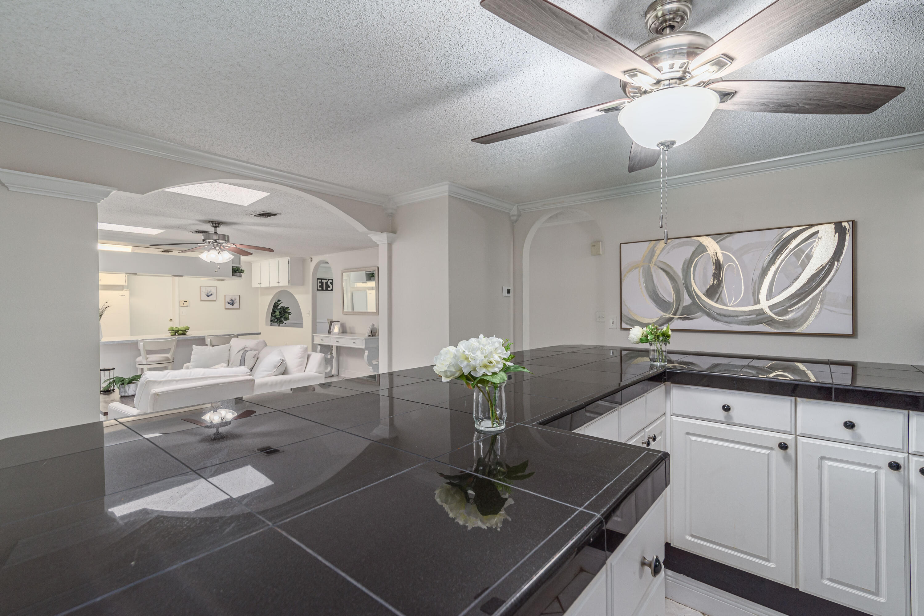 207 Country Club Road Shalimar, FL 32579 - Photo 35 of 60 a kitchen with a table and a chandelier