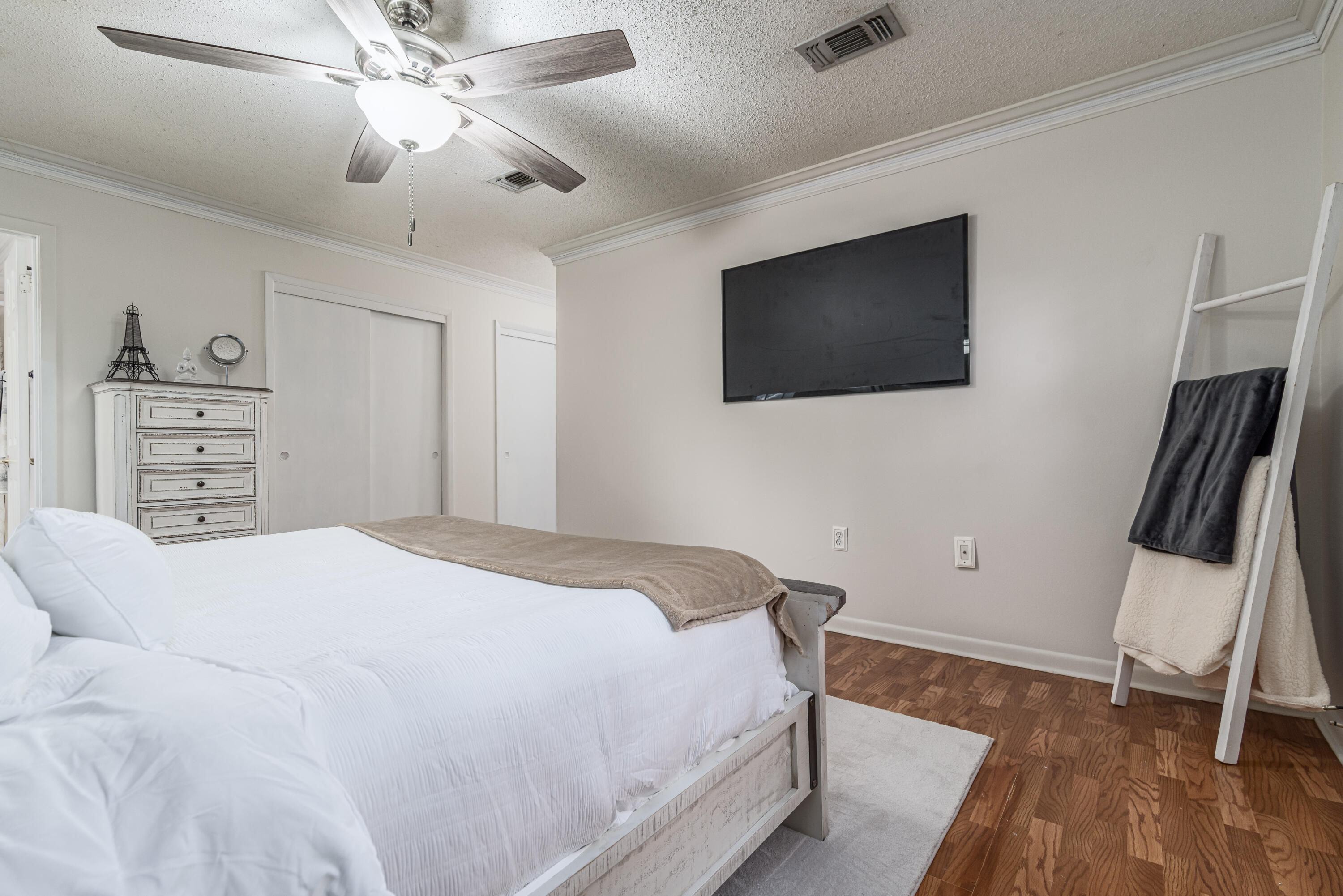207 Country Club Road Shalimar, FL 32579 - Photo 39 of 60 a bedroom with a bed and a flat screen tv