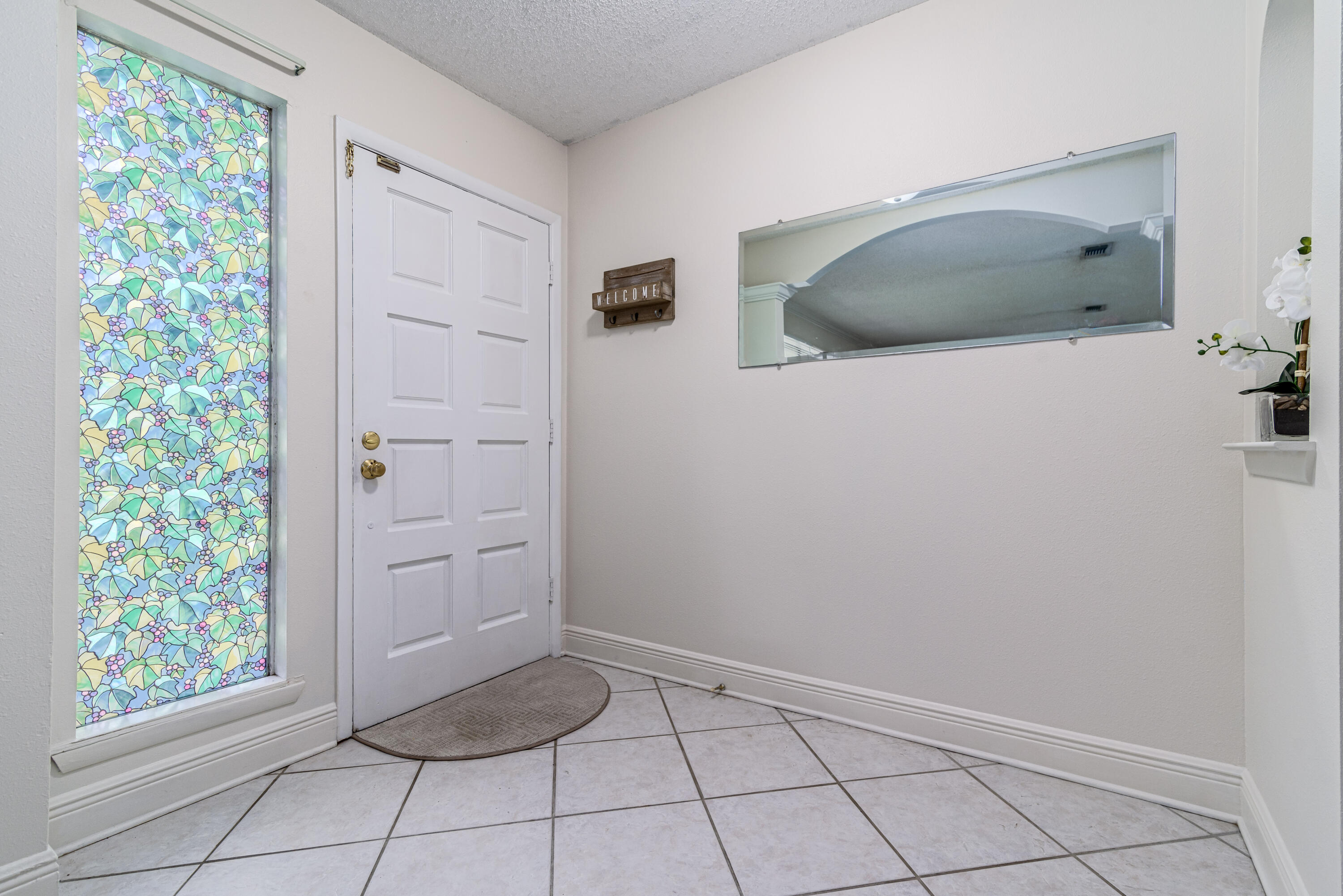 207 Country Club Road Shalimar, FL 32579 - Photo 5 of 60 a bathroom with a granite countertop sink and a mirror
