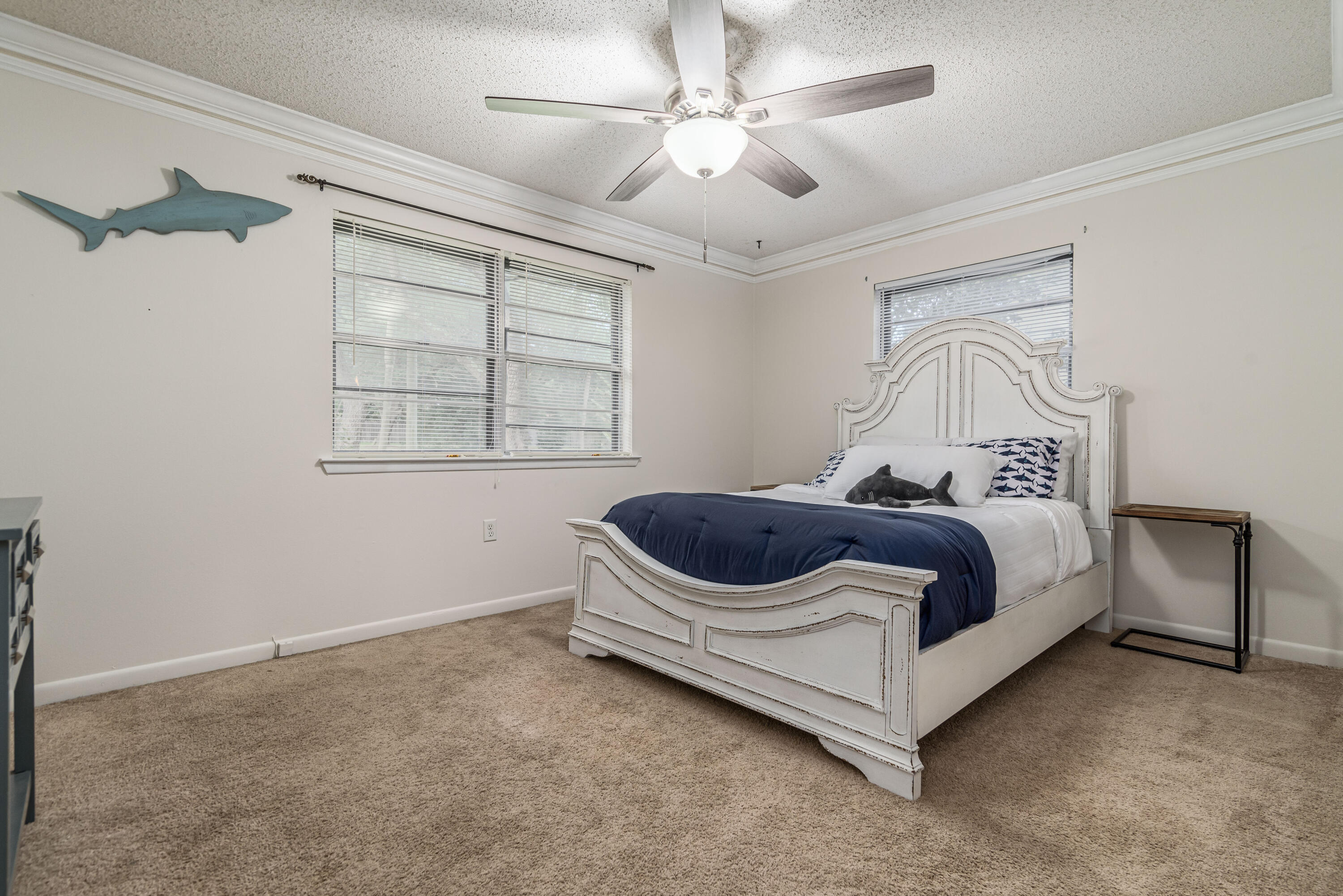 207 Country Club Road Shalimar, FL 32579 - Photo 43 of 60 a bedroom with a bed and a window