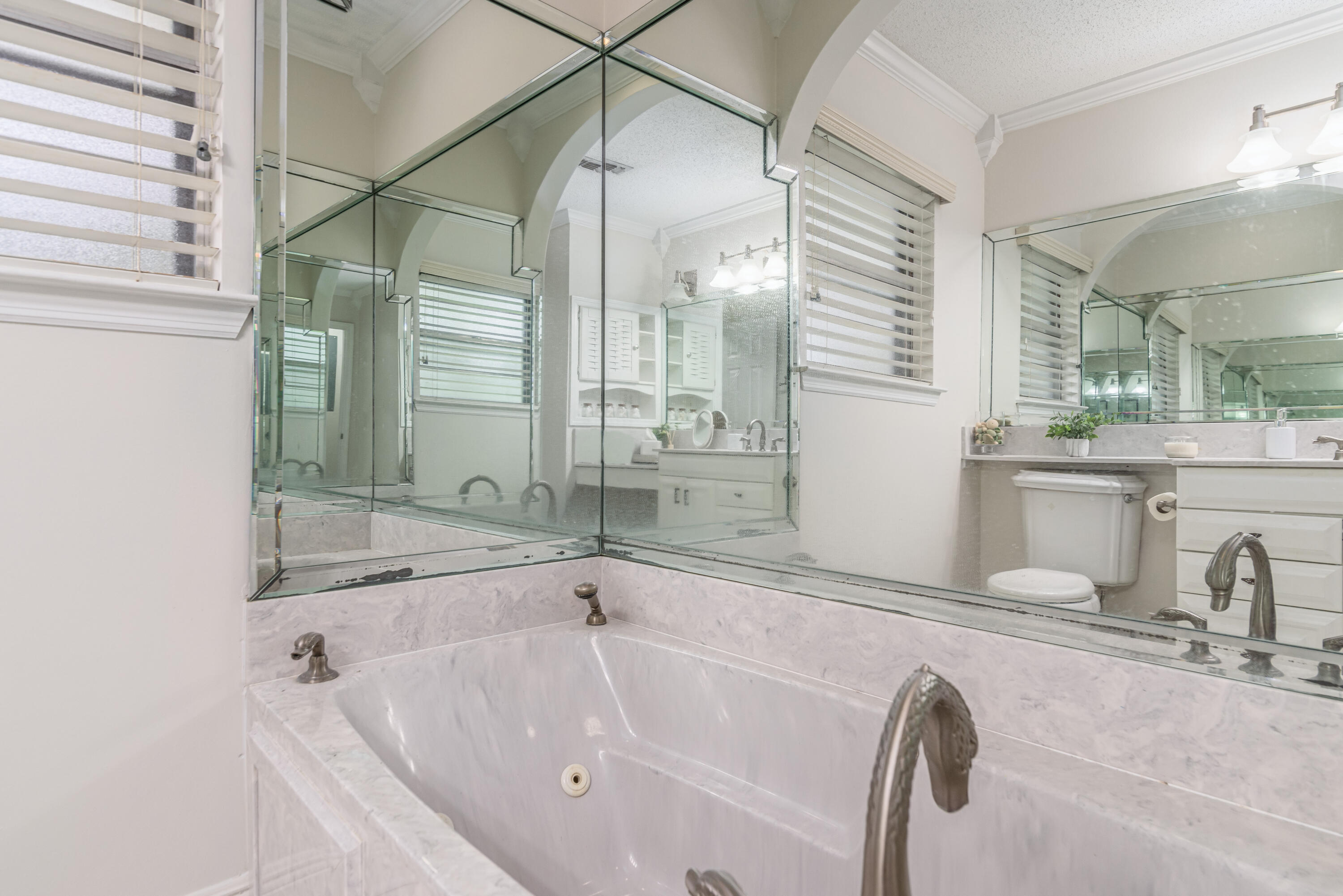 207 Country Club Road Shalimar, FL 32579 - Photo 51 of 60 a bathroom with a tub sink and mirror