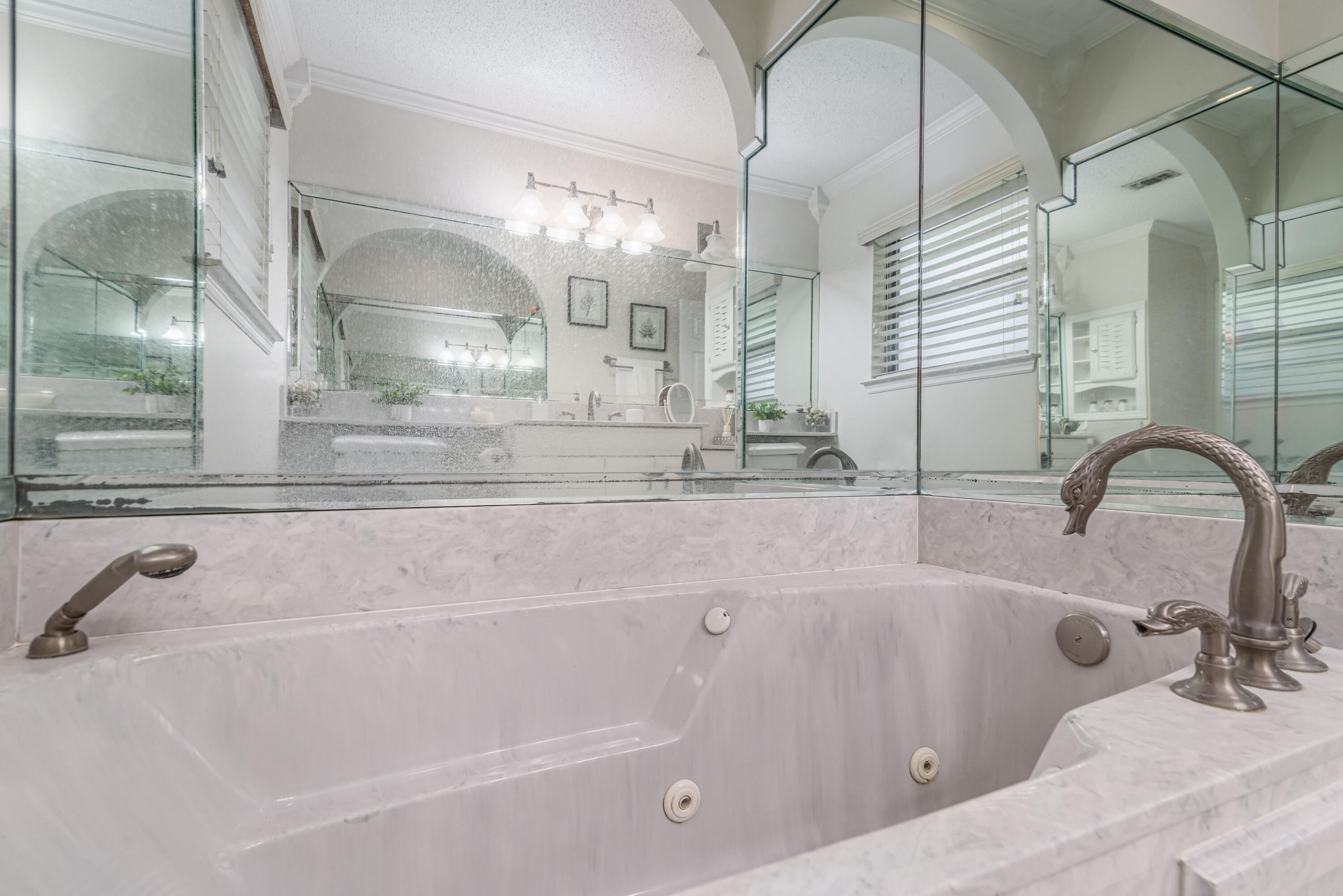 207 Country Club Road Shalimar, FL 32579 - Photo 52 of 60 a bathroom with a tub sink and mirror