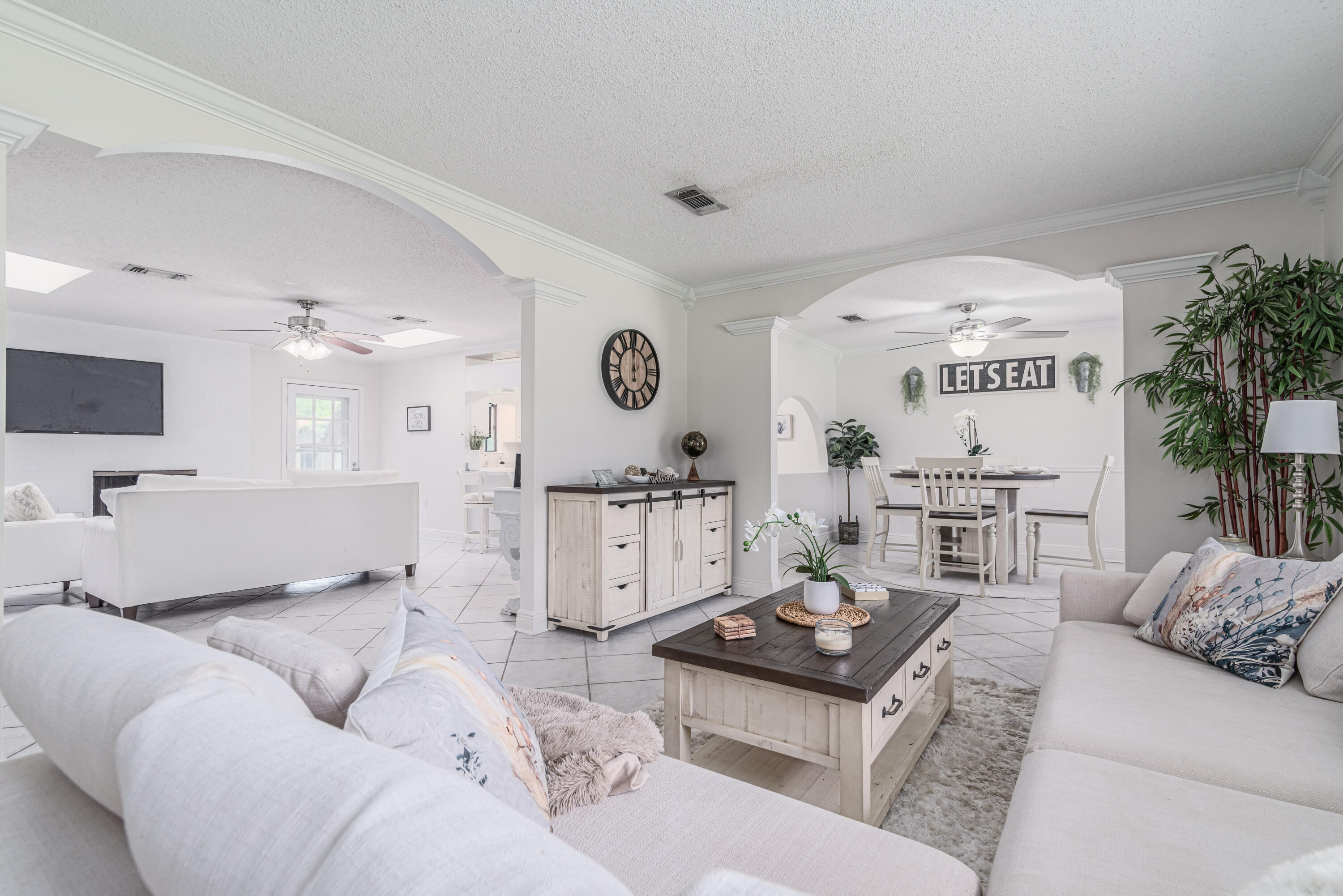 207 Country Club Road Shalimar, FL 32579 - Photo 7 of 60 a living room with furniture and a flat screen tv