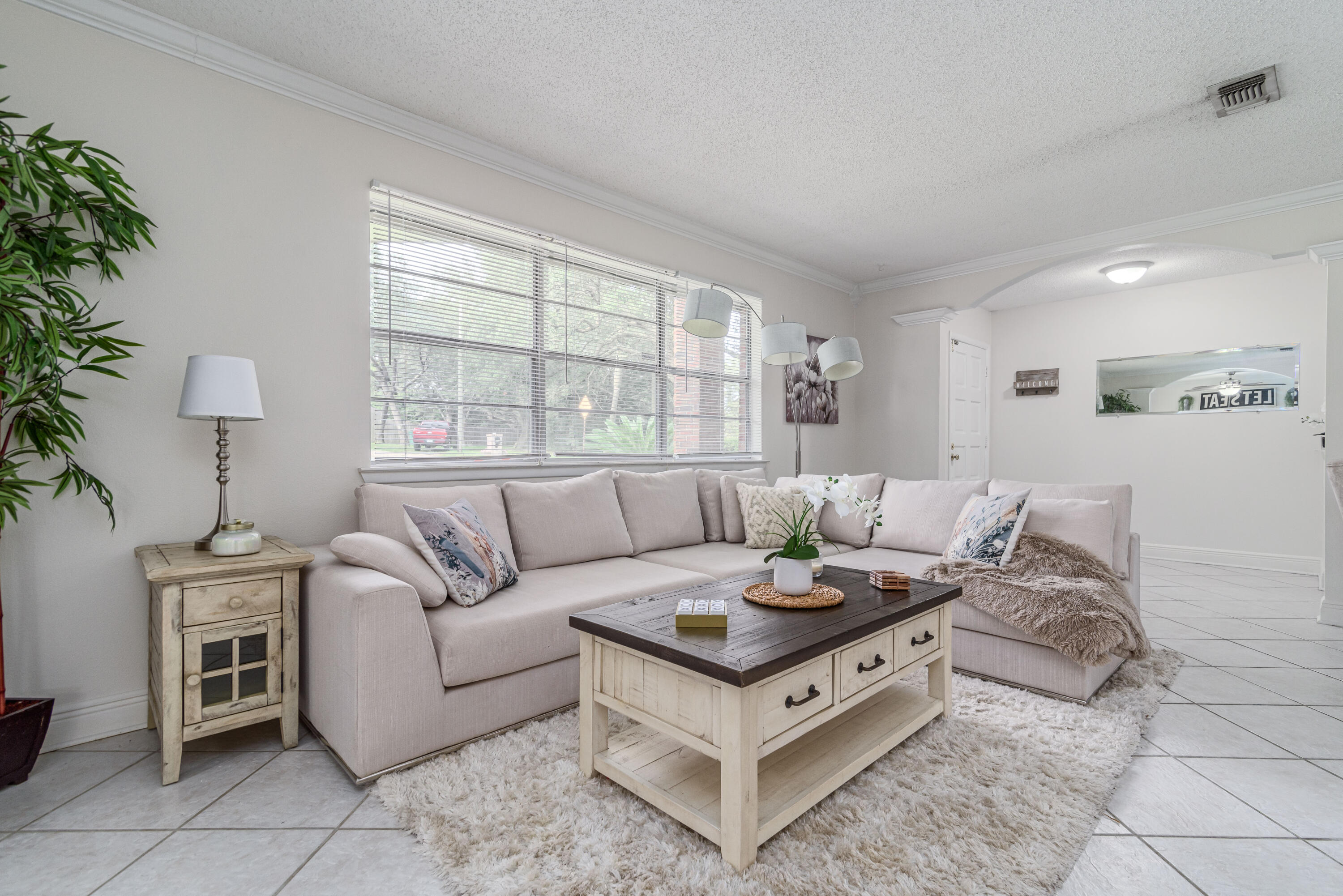 207 Country Club Road Shalimar, FL 32579 - Photo 9 of 60 a living room with furniture and a large window