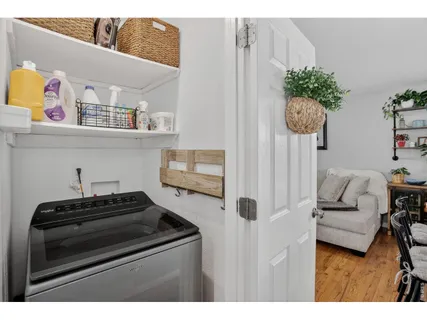 a kitchen with a stove a microwave and cabinets