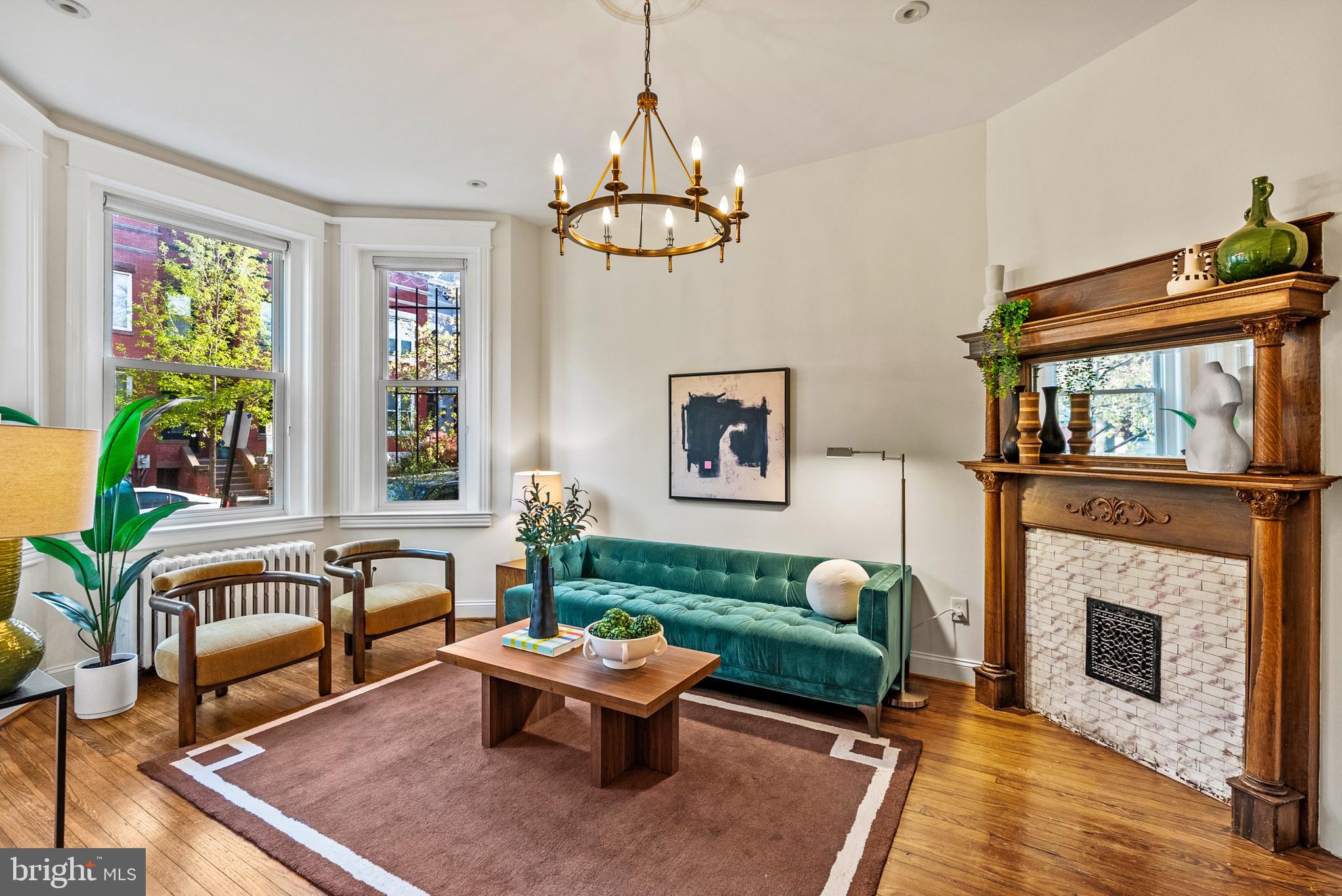 a living room with furniture fireplace and window
