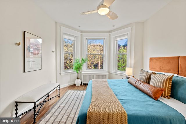 a bathroom with a shower sink vanity and mirror