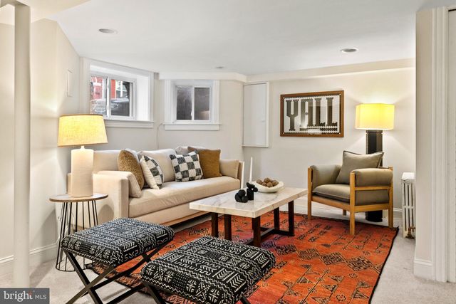 a bathroom with a sink a mirror and a window