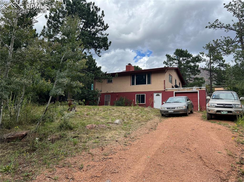 4415 Heizer Street Cascade, CO 80809 - Photo 48 of 50 large lot with lots of trees and natural landscape