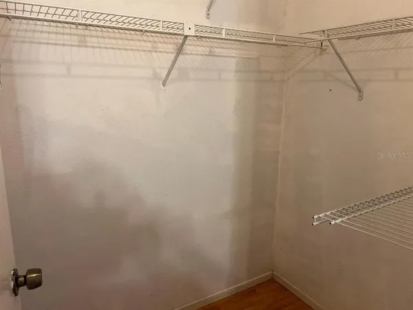 a bathroom with a tub and toilet