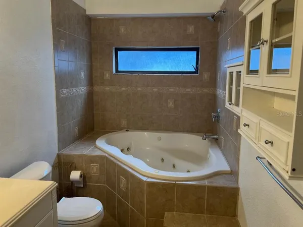 a view of a bathroom with a sink and a shower