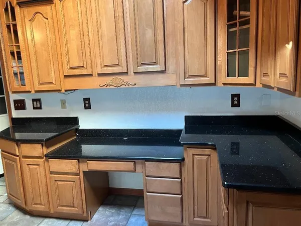 a kitchen with stainless steel appliances white cabinets and a sink