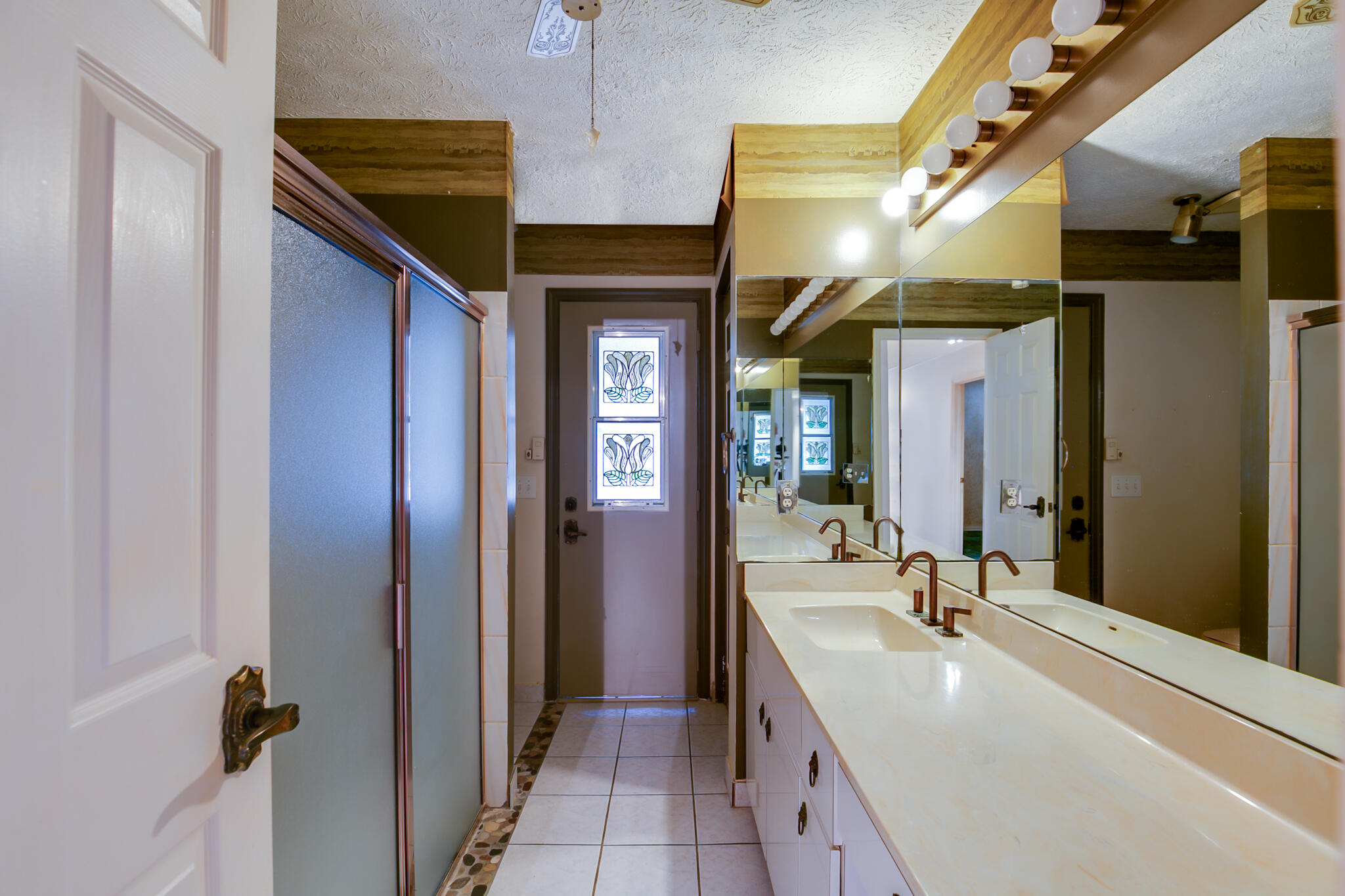 3013 Southeast Darien Road Port St. Lucie, FL 34952 - Photo 19 of 25 a bathroom with a double vanity sink and mirror