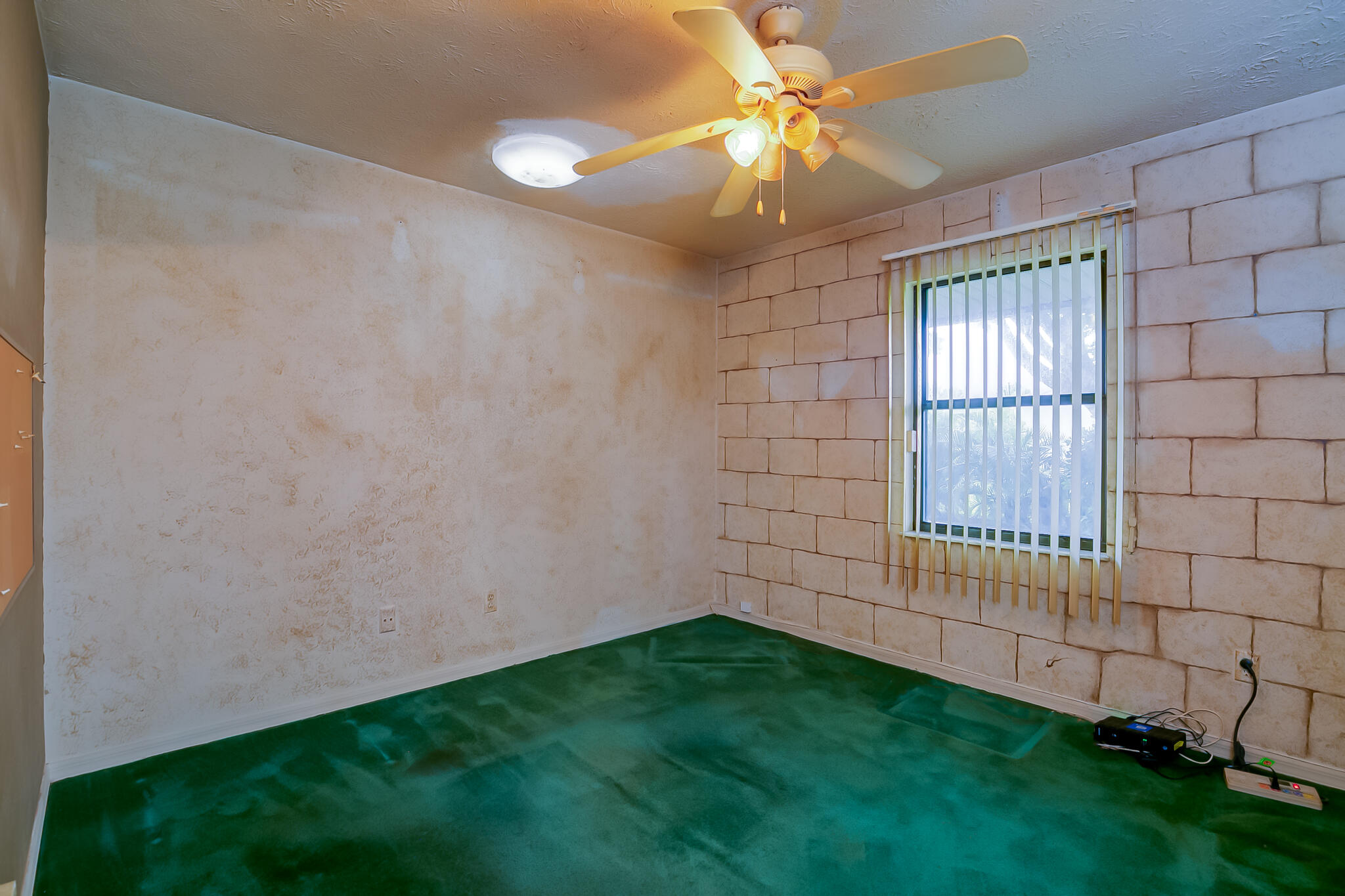 3013 Southeast Darien Road Port St. Lucie, FL 34952 - Photo 20 of 25 a view of room with window and a ceiling fan