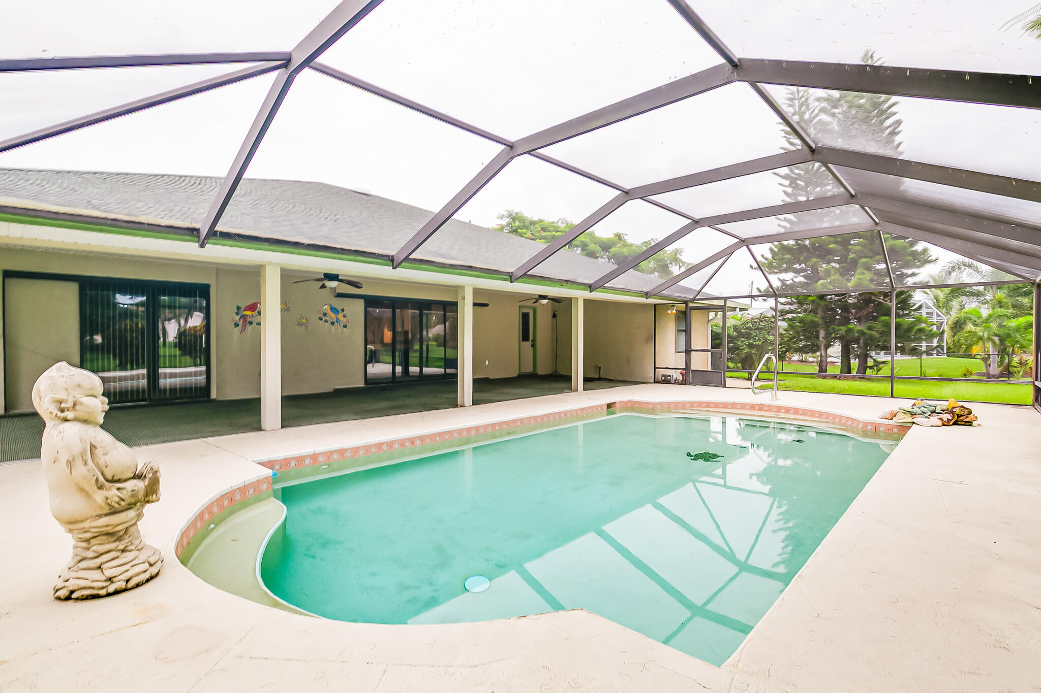 3013 Southeast Darien Road Port St. Lucie, FL 34952 - Photo 22 of 25 a view of a white building with swimming pool in front of it