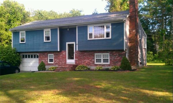 120 Howland Road Freetown, MA 02702 - Photo 1 of 14 a front view of a house with a garden