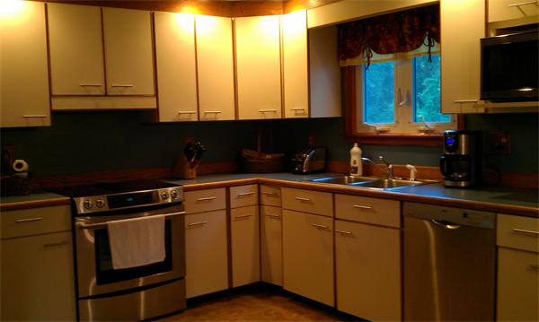 120 Howland Road Freetown, MA 02702 - Photo 2 of 14 a kitchen with stainless steel appliances granite countertop a sink a stove and cabinets