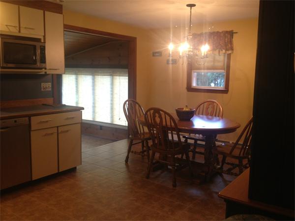 120 Howland Road Freetown, MA 02702 - Photo 3 of 14 a view of a dining room with furniture and chandelier