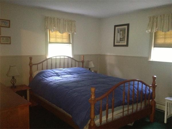 120 Howland Road Freetown, MA 02702 - Photo 10 of 14 a bed sitting in a bedroom next to a window