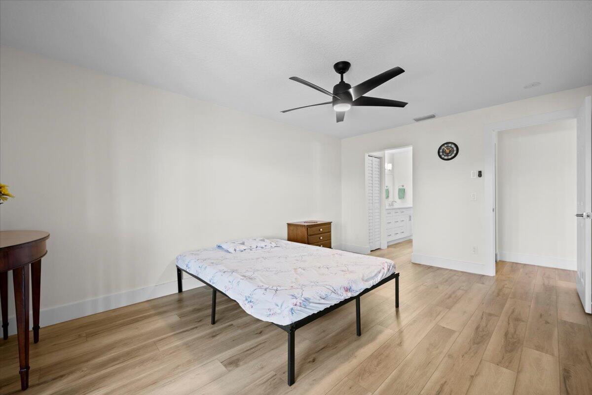 302 Pinecrest Circle, Unit D Jupiter, FL 33458 - Photo 10 of 23 Primary Bedroom