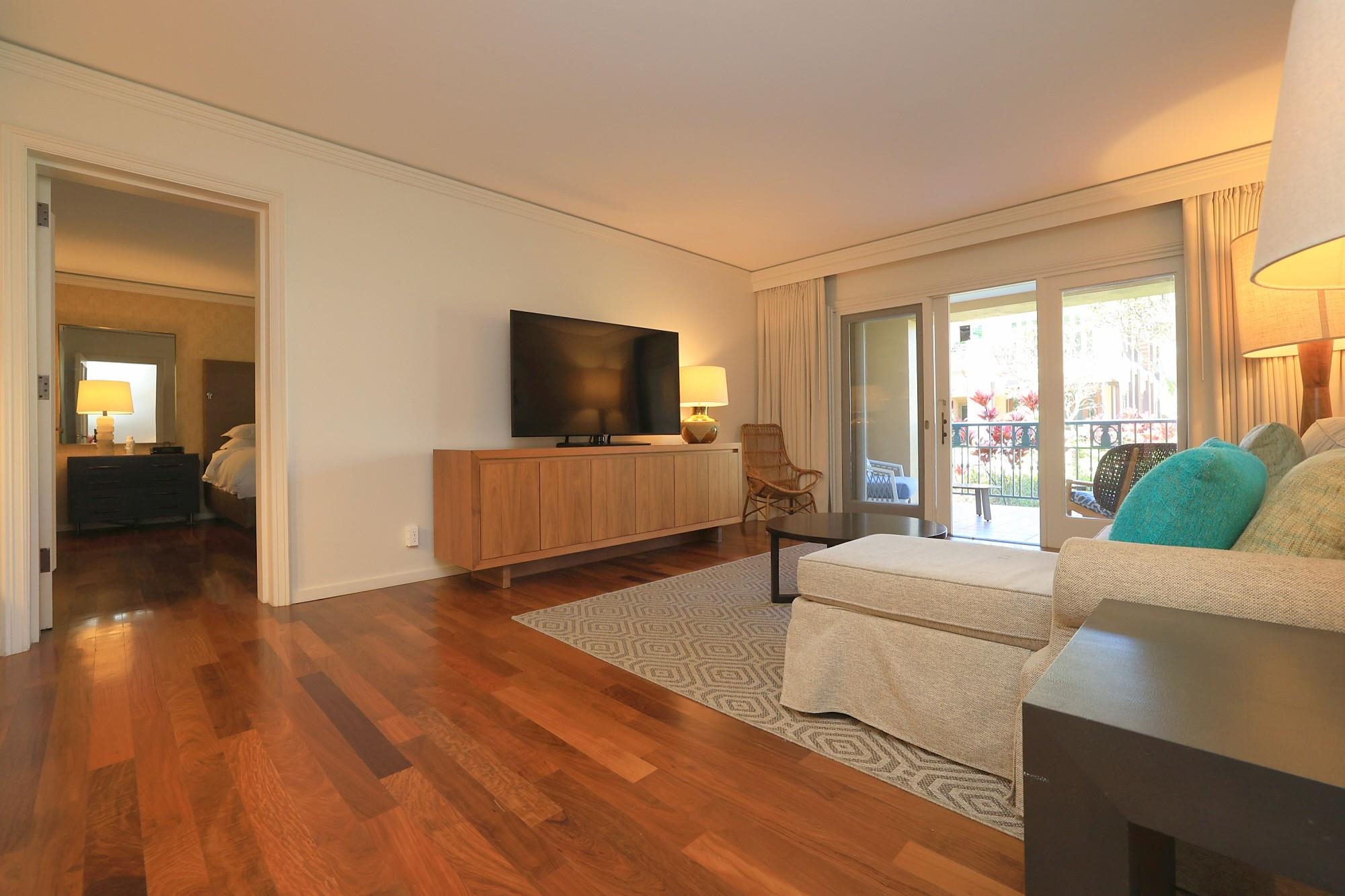 1 Ritz Carlton Drive, Unit 1502 Lahaina, HI 96761 - Photo 11 of 47 a living room with furniture and a flat screen tv
