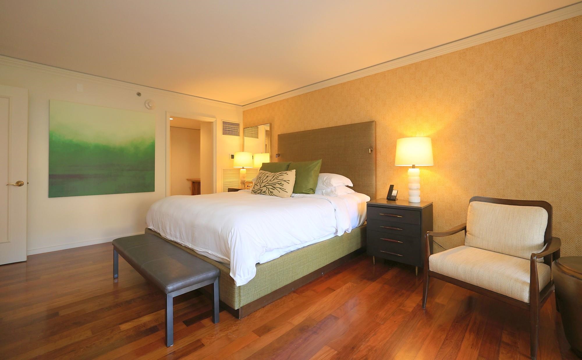 1 Ritz Carlton Drive, Unit 1502 Lahaina, HI 96761 - Photo 19 of 47 a bedroom with a bed and a chair